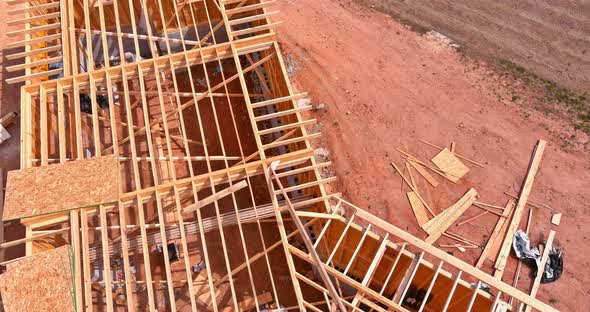 Construction Working on the Roof of Under Construction Wooden Built Home