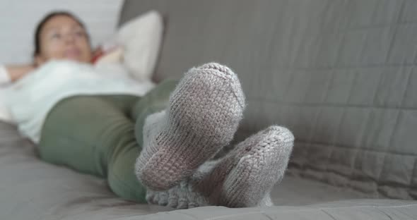Wool socks on woman feet. 