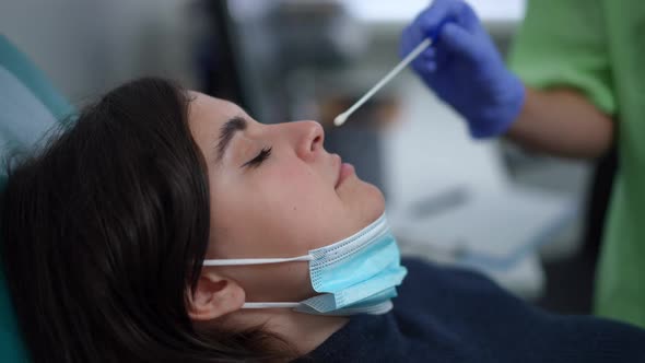 Closeup Taking Nasal Swab Probe for Coronavirus Infection Examination in Medical Clinic