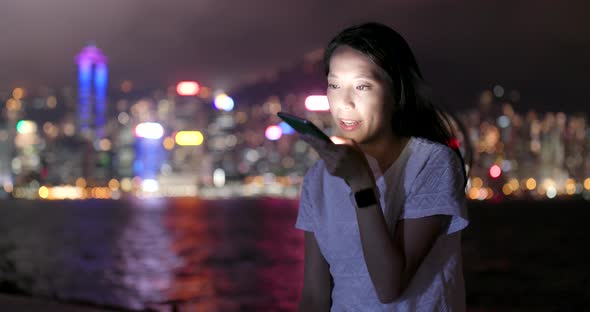 Young woman use of smart phone at night