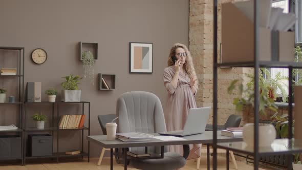 Expecting Woman Talking on Phone