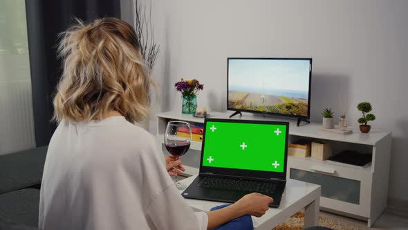 Smiling woman tell a story in a video chat with a friend