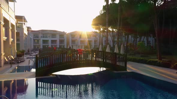 Outdoor Swimming Pool and Hotel at Sunrise.