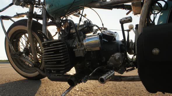 Closeup Dolly Shot of Custom Cafe Racer Motorcycle at Sunset on Street