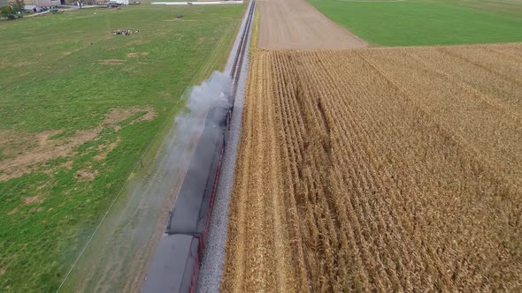 Antique Restored Steam Train Traveling thru Farm Lands