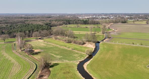 Aerial view of a small river crossing the countryside, Overijssel, Netherlands.