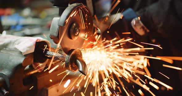 Grinding Metal with Sander at Metal Industry Factory