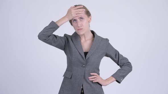 Young Stressed Blonde Businesswoman Having Headache