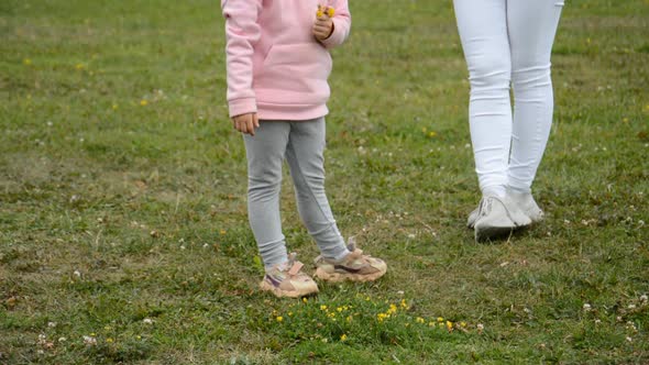 Feet of Mom and Little Gir