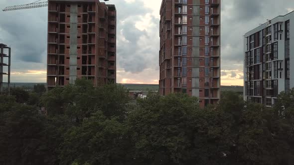 Aerial view of tall residential apartment buildings under construction. Real estate development.