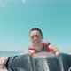 Teenager man enjoying summer in a jet ski in the middle of the sea having fun racing alone - VideoHive Item for Sale