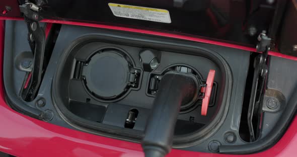 Connecting the Charger Plug of an Electric Car