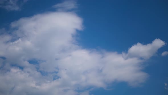 Clouds Move Smoothly in the Blue Sky. Timelapse