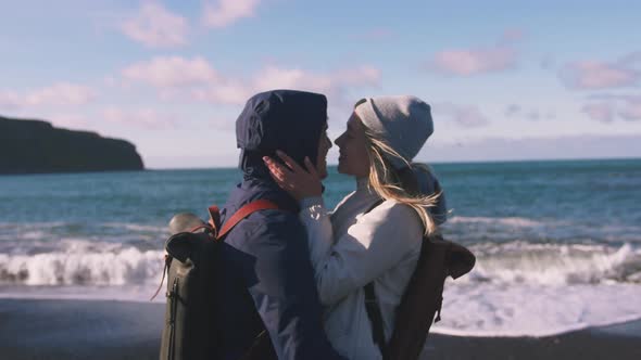 Young Loving Couple Hugging and Enjoing View on Beach in Iceland Slow Motion