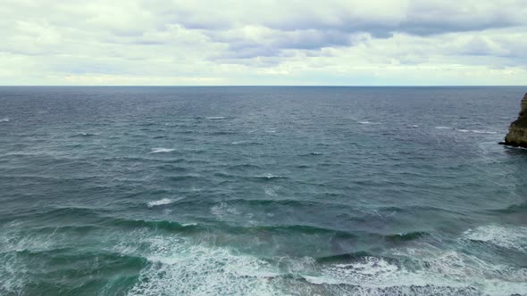 High and powerful waves coming fast to the beach, waves in winter day