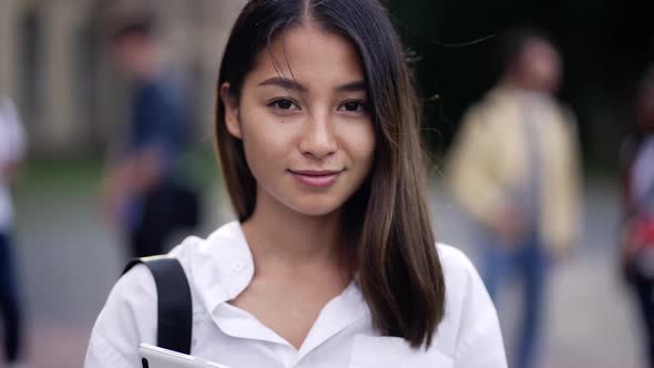 Pretty Asian Girl Student Posing on Camera Outdoor