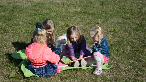 Four Little Girls Playing on the Lawn