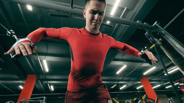 A Man Is Having a Crossfit Practice and Stretching His Arms