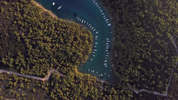 Aerial view of boats anchored at the shore of Krivica, Croatia.