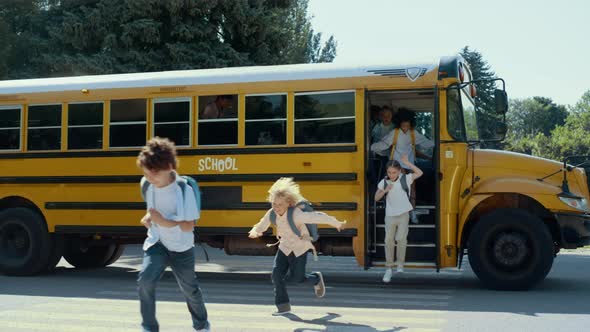 Smiling Students Leaving Yellow School Bus