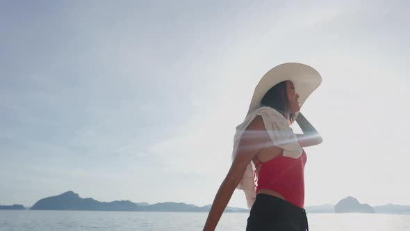 Woman Walking Along Shore Of Entalula Beach