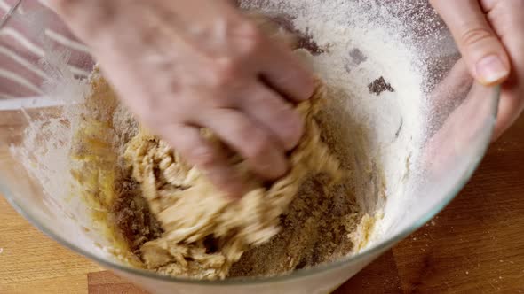 Female Hand Kneads Spicy Dough for Gingerbread at Table