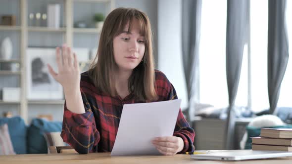 Casual Young Girl Upset after Reading Documents, Loss