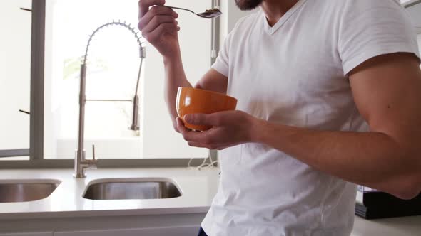 Man having breakfast in kitchen