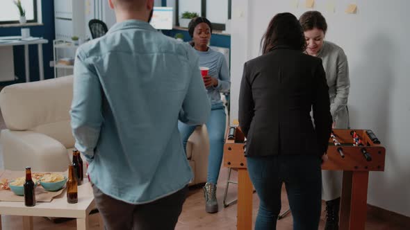 Group of Coworkers Enjoying Fun Activity After Work