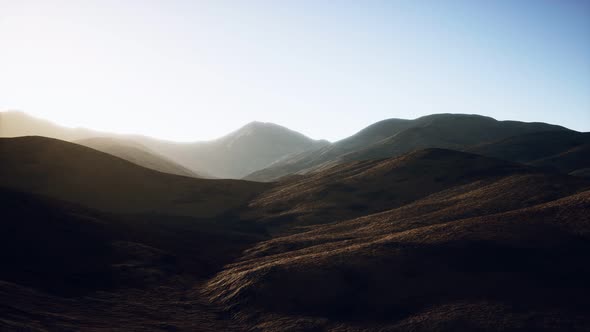 Hills with Rocks at Sunset