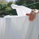 Beautiful Young Housewife Hanging Up Wet Clothes On Clothesline in Countryside - VideoHive Item for Sale