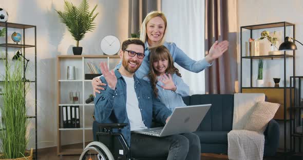 Modern Family in Wheelchair which Posing on Camera