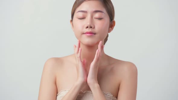 facial beauty skin concept asian female attractive and healthy skin closeup hand touch softy face