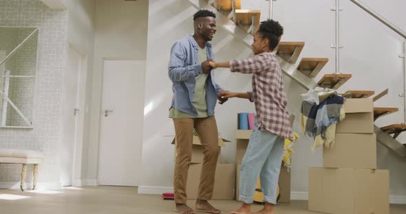 Video of happy african american couple embracing after moving into new house