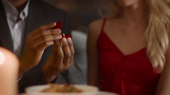 Unrecognizable Woman Rejecting Marriage Proposal With Gesture In Restaurant Cropped