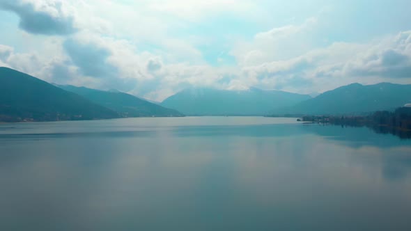 Ascending aerial shot, showing the Tegernsee in bavaria on a cloudy day, view towards Rottach Egern.