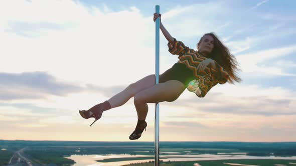Pole Dance on Nature - Sexy Woman in Swimsuit Dancing on the Top of Dancing Pole
