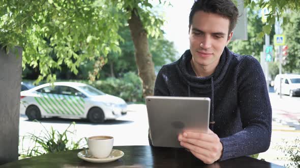 Happy Man Using Tablet