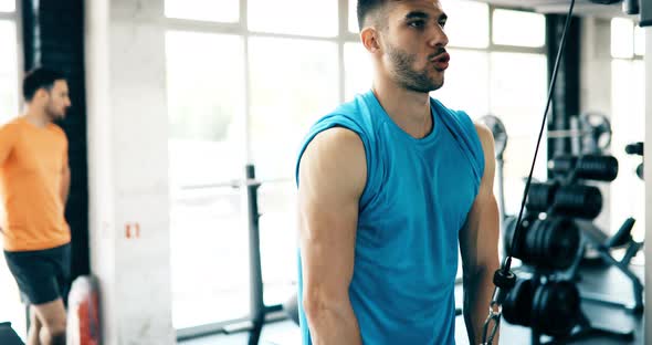 Portrait of Handsome Man Doing Exercises for Chest