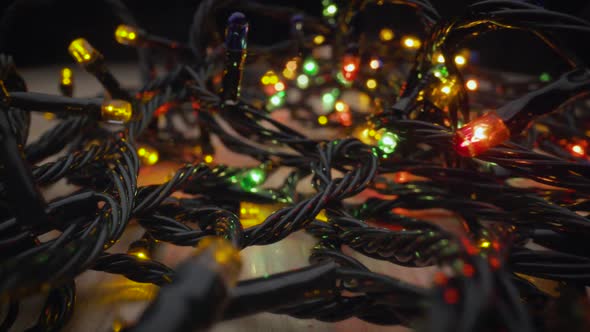 Christmas Garland with Multi Colored Bulbs and Lights Christmas Coloured Small Lights Close Up