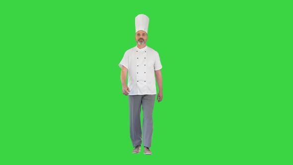 Senior Chef in White Uniform Walking on a Green Screen Chroma Key