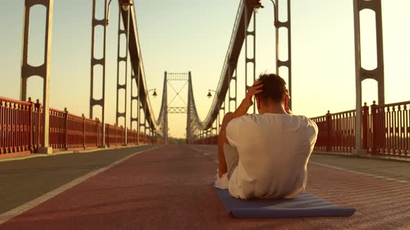 Back View of a Man Doing Abs