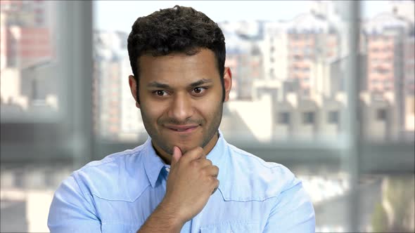 Cunning Hindu Businessman Thinking About Something Evil