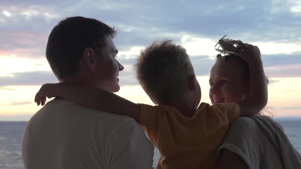 Child with Toy Plane and Parents Outdoor