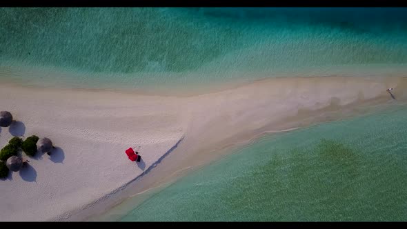 Aerial drone shot seascape of relaxing lagoon beach holiday by shallow ocean and white sand backgrou