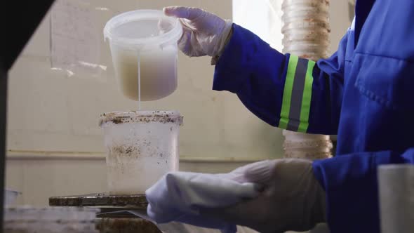 Mixed race man working in factory