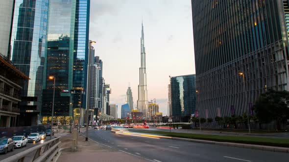 Traffic Dubai with Skyscrapers Time Lapse. Pan Up