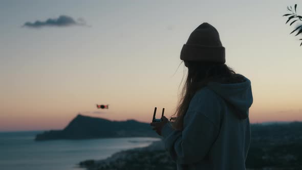 Young Woman Using Aerial Drone to Take Pictures