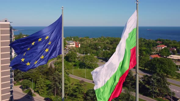 European Union and Bulgaria Flags Against City Varna at Summer Day