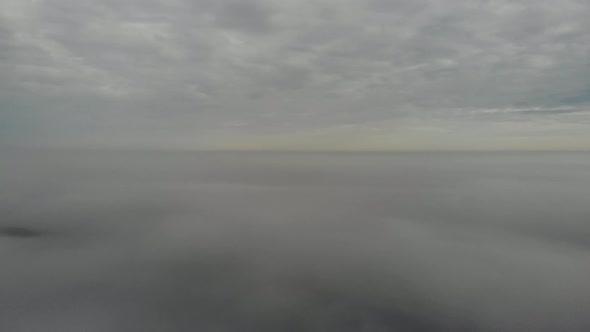 Flying over clouds. Video shot by drone in early morning